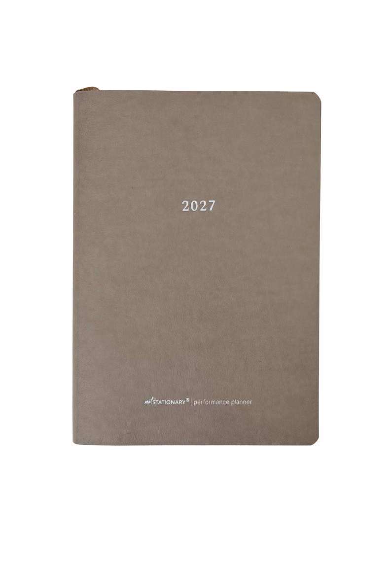 A 2027 performance planner in a textured taupe-brown cover, featuring a minimalist design with '2027' printed in silver in the center and the 'NexGen' logo at the bottom.