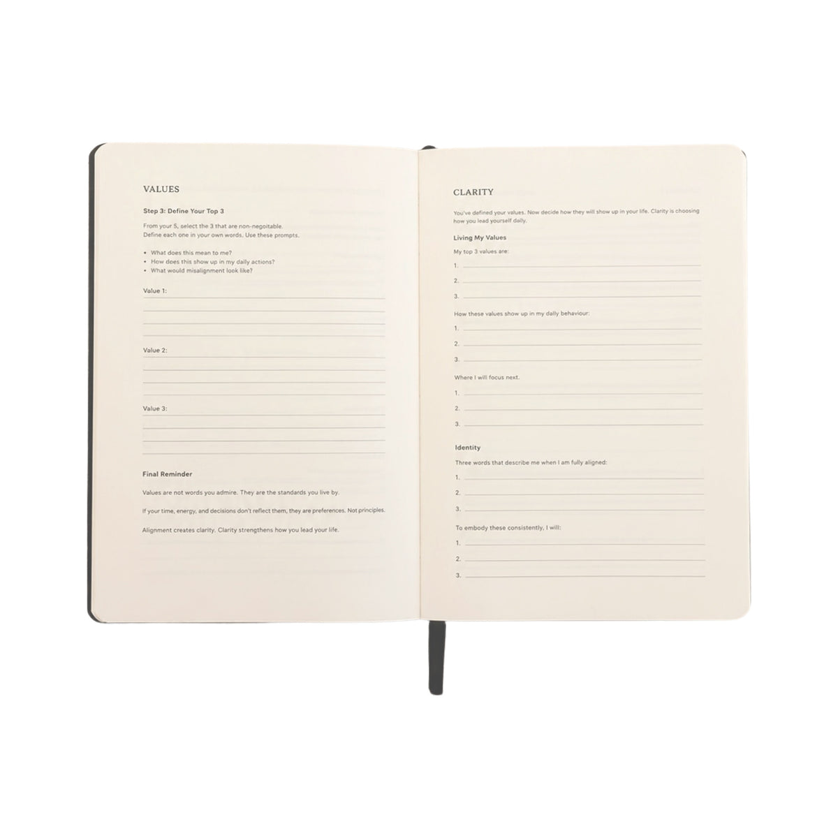 An open notebook showing two cream-colored interior pages with printed reflection prompts under headings 'VALUES' and 'CLARITY', photographed on a plain white background.