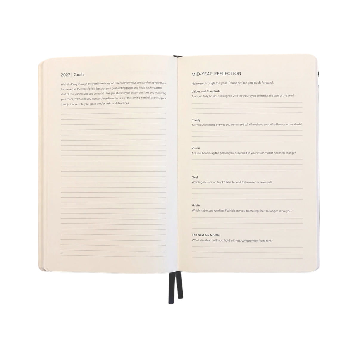 An open hardcover journal showing two interior pages with writing guides titled '2027 Goals' and 'Mid-Year Reflection,' photographed on a plain white background.