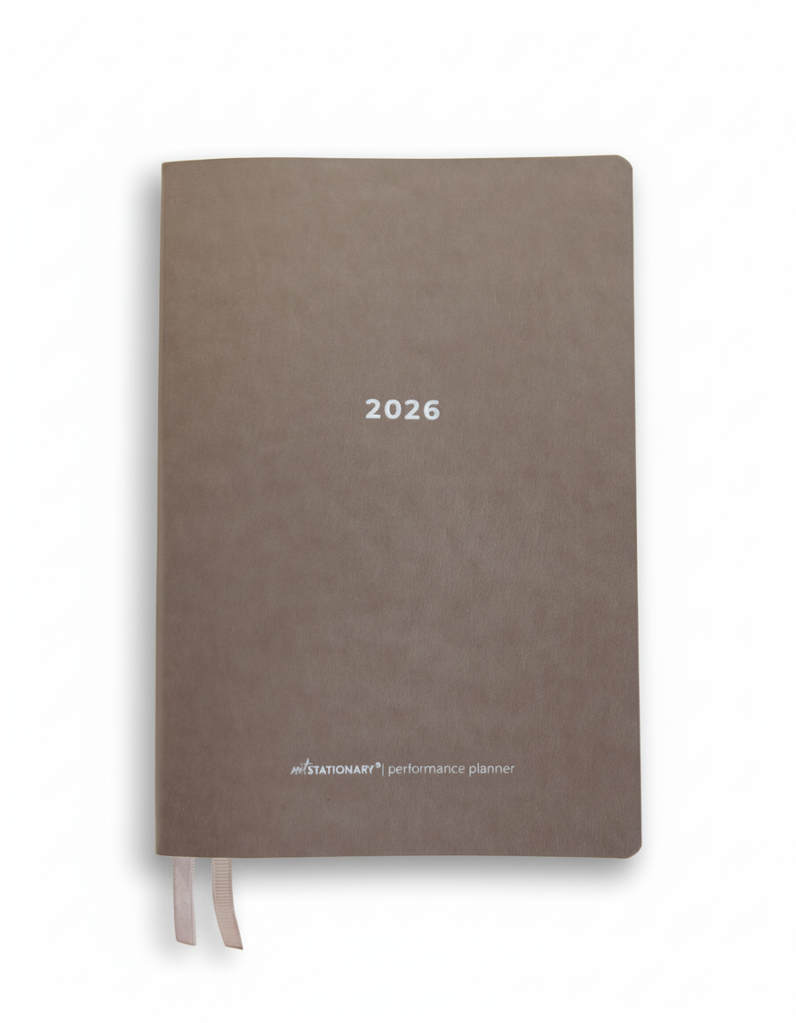 2026 Not Stationary Performance Planners in minimalist stone cover with ribbon bookmarks, designed for intentional living and high performance.