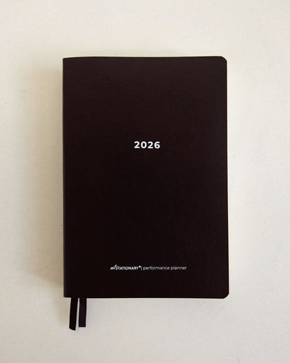 2026 Not Stationary Performance Planners in minimalist black with ribbon bookmarks, designed for intentional living and high performance.
