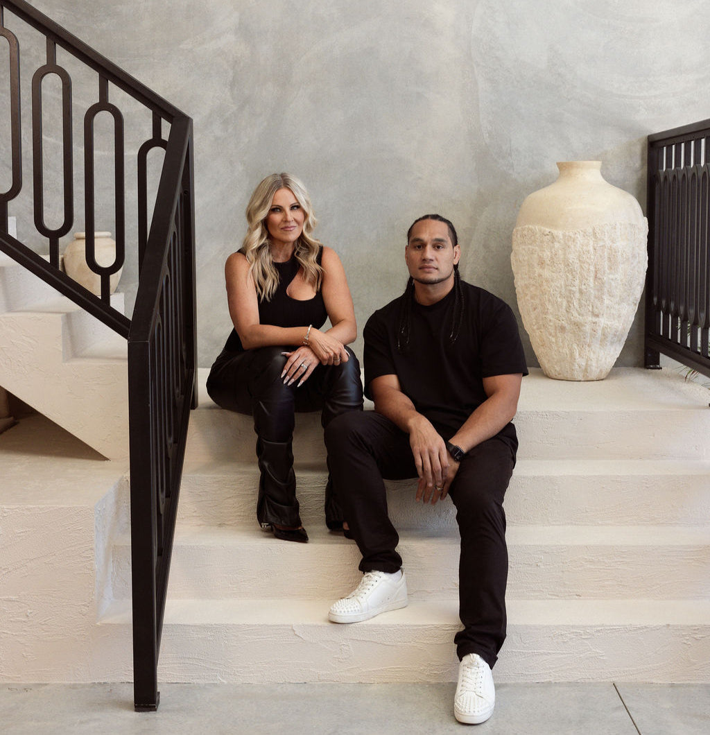 Not Stationary founders Michelle and Martin Taupau seated together in a modern interior